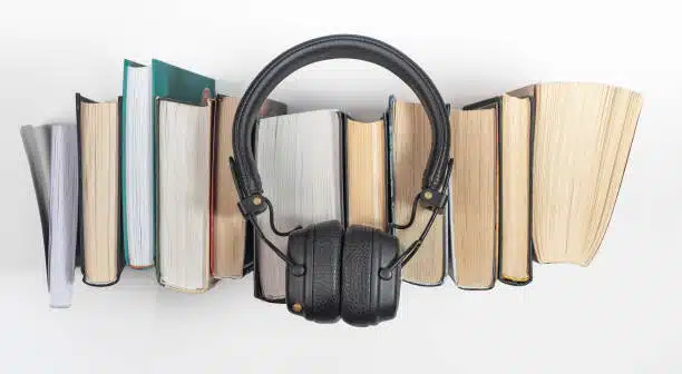 audiobooks stack with headphones, top view